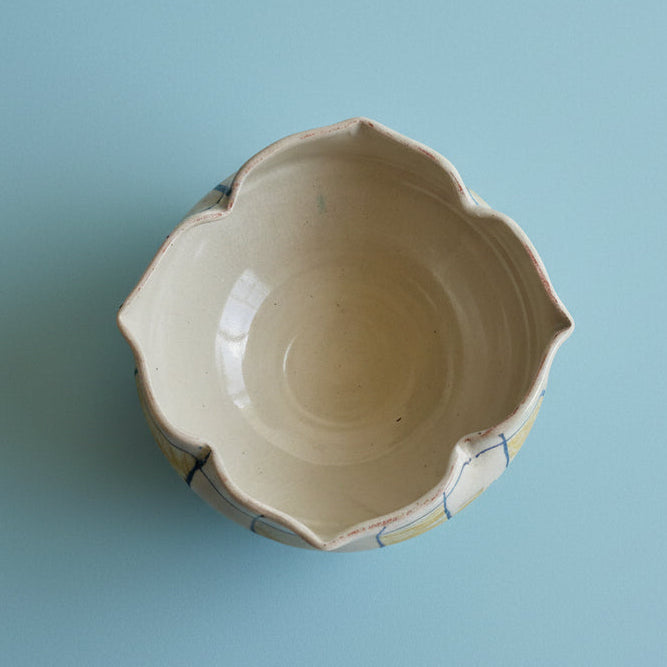 Ceramic bowl with a textured surface on a plain background