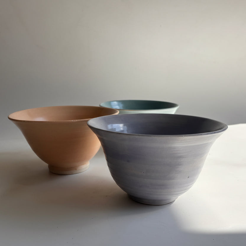 Ceramic vase with a unique design on a plain background