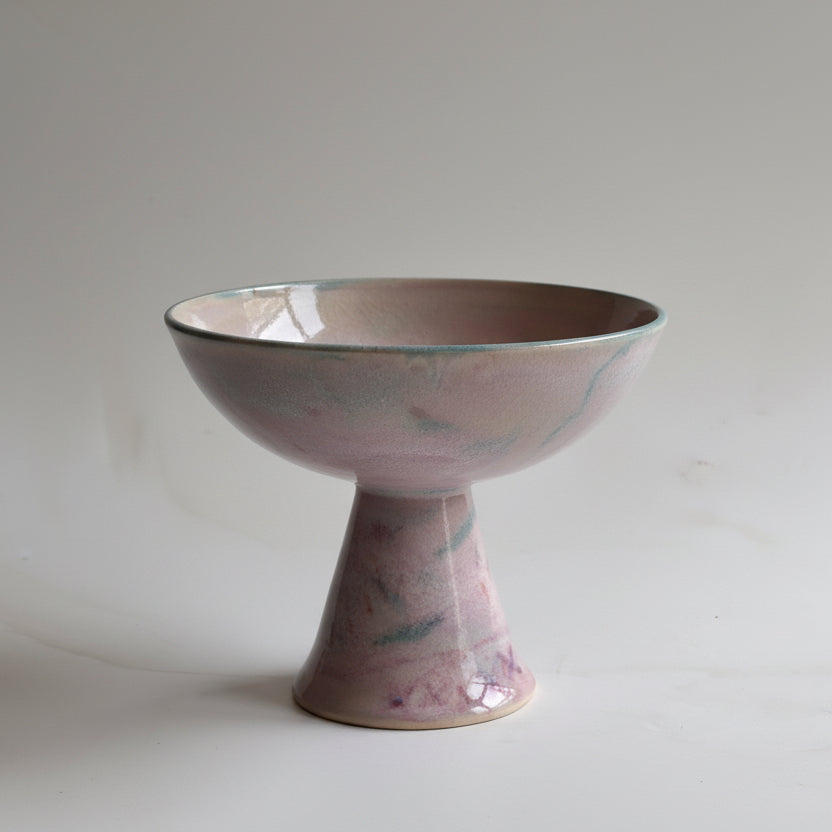 Purple ceramic bowl on a white background