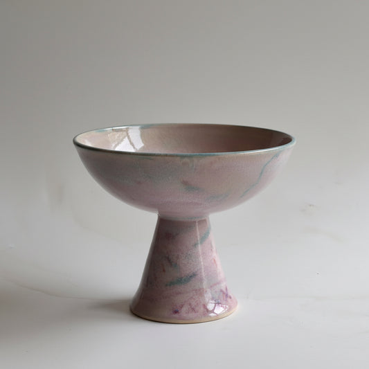 Purple ceramic bowl on a white background