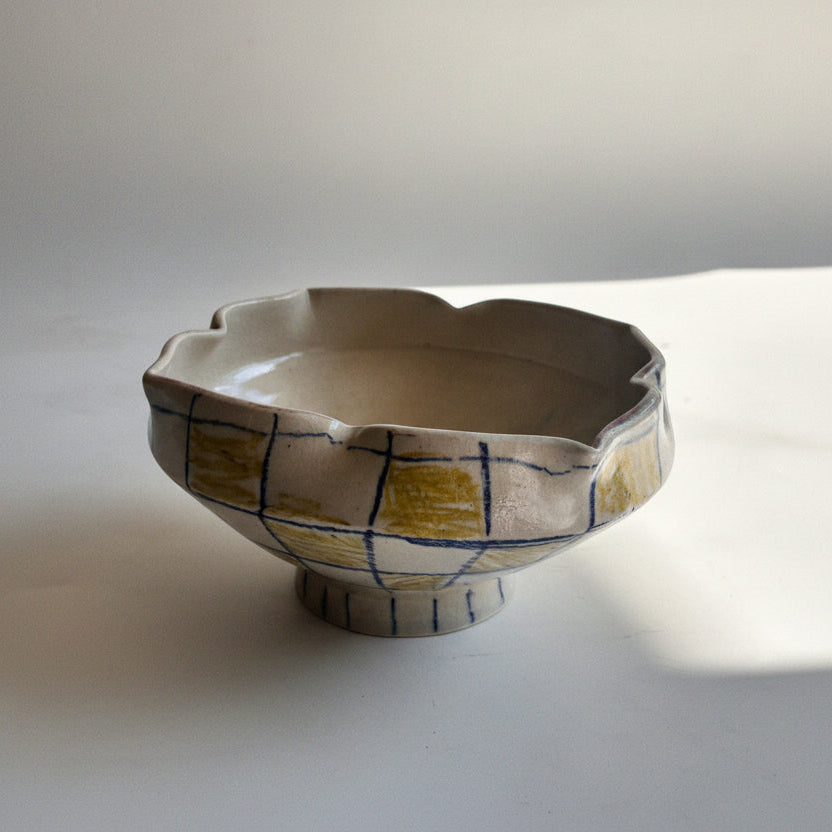 Ceramic bowl with abstract design on a white background